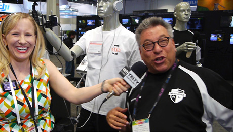 MXL Mics Director of Sales & Marketing, Perry Goldstein demos the company's Mobile Media Mannequins to YBLTV Anchor, Erika Blackwell at NAB 2014.
(Image Courtesy: MXL Mics/Your Biz LIVE).