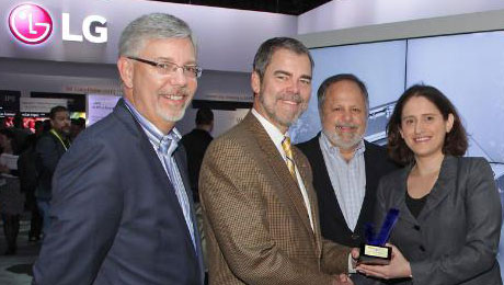 Reviewed.com President and CEO, Robin Liss, President and Publisher of USA Today, Larry Kramer, and President, U.S. Community Publishing at Gannett Company, Inc., Bob Dickey, present David VanderWaal, head of marketing for LG Electronics USA, with the Reviewed.com CES Editors' Choice Award for LG's TWIN Wash System at the 2015 INTERNATIONAL CES(R). (PRNewsFoto/LG Electronics USA, Inc.)